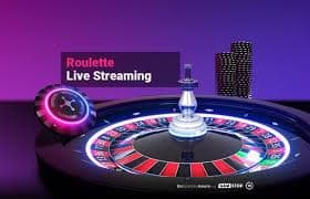 Live roulette table with ball spinner and player interface